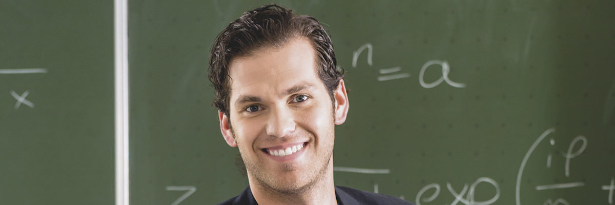 Teacher or docent in school holding a pointer in front of a blackboard in school class Schlagwort(e): teacher, school, blackboard, pedagogue, teach, teaching, lesson, class, knowledge, learning, educate, education, literacy, educator, tutor, docent, lecturer, profession, occupation, board, pointer, chalkboard, mark, grade, work, test, elementary, basic, primary, grammar, grade, middle, secondary, gymnasium, integrated, college, man, young, people, Caucasian